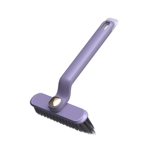 Purple crevice cleaning brush with a rotating head and dark bristles.